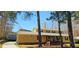 View of house showcasing the covered front porch and yellow vinyl siding at 1406 High Sierra Dr, Lawrenceville, GA 30043