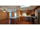 Well-lit kitchen featuring a center island, stainless appliances, and a seamless transition to the dining area at 1406 High Sierra Dr, Lawrenceville, GA 30043