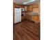 Efficient kitchen with wood cabinets, a white refrigerator, and stainless-steel microwave at 1406 High Sierra Dr, Lawrenceville, GA 30043
