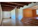 Spacious living room featuring hardwood floors, ceiling fans, and exposed wood beam ceilings at 1406 High Sierra Dr, Lawrenceville, GA 30043