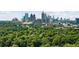 An aerial view of the city skyline surrounded by lush greenery at 2277 Peachtree Rd # 503, Atlanta, GA 30309
