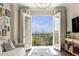Balcony view to lush tree view in a charming living room at 2277 Peachtree Rd # 503, Atlanta, GA 30309