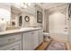Bright bathroom featuring a vanity, mirror, and a combined tub and shower at 2277 Peachtree Rd # 503, Atlanta, GA 30309