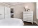 Bedroom with wood floors, white trim and furniture, and access to the kitchen at 2277 Peachtree Rd # 503, Atlanta, GA 30309