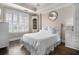 Bright bedroom with a bed, shutters, and ample storage at 2277 Peachtree Rd # 503, Atlanta, GA 30309