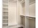 Custom walk-in closet features built-in shelving and ample storage space at 2277 Peachtree Rd # 503, Atlanta, GA 30309