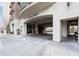 The Aramore porte cochere entrance with detailed brickwork and manicured landscaping at 2277 Peachtree Rd # 503, Atlanta, GA 30309