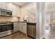 Modern kitchen with stainless steel appliances and dark countertops at 2277 Peachtree Rd # 503, Atlanta, GA 30309