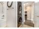Modern stacked washer and dryer, adjacent to the bathroom and kitchen at 2277 Peachtree Rd # 503, Atlanta, GA 30309