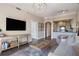 Well-designed living room with TV, kitchen access, and stylish furnishings at 2277 Peachtree Rd # 503, Atlanta, GA 30309