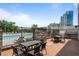 Outdoor dining and grilling area with sleek furniture and a view of the pool at 2277 Peachtree Rd # 503, Atlanta, GA 30309