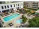 Aerial view of building featuring pool and whirlpool with lounge seating and covered outdoor gathering space at 2277 Peachtree Rd # 503, Atlanta, GA 30309