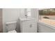 Bright bathroom boasts modern fixtures, a window, and neutral color palette at 2831 Centerville Rosebud Rd, Snellville, GA 30039