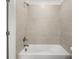 Clean, bright bathroom features a tile surround bathtub and shower at 2831 Centerville Rosebud Rd, Snellville, GA 30039