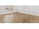 Bright bedroom with wood floors and window allowing natural light at 2831 Centerville Rosebud Rd, Snellville, GA 30039