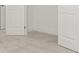 Clean and tidy bedroom view showcasing neutral carpet with white door, baseboard, and trim at 2831 Centerville Rosebud Rd, Snellville, GA 30039