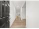 Inviting entryway with light wood floors, white walls and a dark front door, creating a bright and modern entrance at 2831 Centerville Rosebud Rd, Snellville, GA 30039