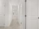 Bright, neutral hallway features streamlined design and recessed lighting at 2831 Centerville Rosebud Rd, Snellville, GA 30039