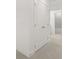 Neutral carpeted hallway with a double door closet that leads to bathroom with tub at 2831 Centerville Rosebud Rd, Snellville, GA 30039