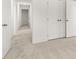 Bright, neutral hallway features streamlined design and linen closet at 2831 Centerville Rosebud Rd, Snellville, GA 30039