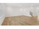 Spacious living area with wood floors, large windows, and staircase at 2831 Centerville Rosebud Rd, Snellville, GA 30039