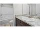 Bathroom featuring a granite countertop, white sink, and a combined tub and shower at 3038 Chris Cir, Villa Rica, GA 30180