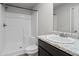 Bathroom featuring a shower, granite sink, and vanity, creating a clean and modern space at 3038 Chris Cir, Villa Rica, GA 30180