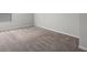 A bright room featuring plush carpet and a window with blinds at 3038 Chris Cir, Villa Rica, GA 30180