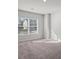 Bright, carpeted bedroom featuring a large window that provides ample natural light at 3038 Chris Cir, Villa Rica, GA 30180