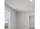 A naturally lit bedroom showcases carpet floors, a window, and white trim at 3038 Chris Cir, Villa Rica, GA 30180