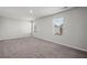 Large bedroom with neutral walls, carpet flooring, and two windows providing plenty of natural light at 3038 Chris Cir, Villa Rica, GA 30180