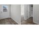Bright entryway with wood-look flooring and a clear view to the second floor at 3038 Chris Cir, Villa Rica, GA 30180