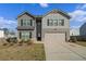 Charming two-story home with a well-maintained lawn and a two-car garage at 3038 Chris Cir, Villa Rica, GA 30180