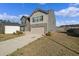Two-story home featuring a two-car garage, driveway, and manicured lawn at 3038 Chris Cir, Villa Rica, GA 30180