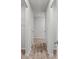 Hallway with wood flooring, complemented by neutral wall paint and white doors at 3038 Chris Cir, Villa Rica, GA 30180