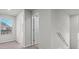 Bright hallway featuring neutral walls, carpet flooring, and a window with views to the outside at 3038 Chris Cir, Villa Rica, GA 30180