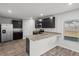 Modern kitchen featuring stainless steel appliances, granite countertops, and dark wood cabinets at 3038 Chris Cir, Villa Rica, GA 30180
