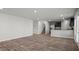Spacious living room featuring hardwood floors, stainless steel appliances, and stairs to the upper level at 3038 Chris Cir, Villa Rica, GA 30180
