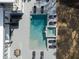 Aerial view of a modern home with a pool, spa, patio with seating, and a dining table at 4031 Oak Forest Cir, Marietta, GA 30062