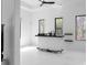 Bright bar area with a stylish white bar, modern lighting, and views of the surrounding landscape at 4031 Oak Forest Cir, Marietta, GA 30062
