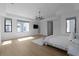 Bright bedroom with a modern chandelier and large windows overlooking the neighborhood at 4031 Oak Forest Cir, Marietta, GA 30062