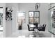 Modern dining room featuring a dining table, large windows and view and a wine cellar at 4031 Oak Forest Cir, Marietta, GA 30062
