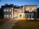 Beautiful modern home with lovely outdoor lights, long driveway and lush landscaping at 4031 Oak Forest Cir, Marietta, GA 30062