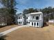 Modern home featuring a sleek design, balcony, and a well-manicured lawn at 4031 Oak Forest Cir, Marietta, GA 30062