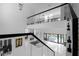 Open foyer showcases the home's bright interior with a glass railing and view of the outdoor pool at 4031 Oak Forest Cir, Marietta, GA 30062