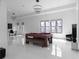 Large game room with a pool table, comfortable seating, stylish lighting, and plenty of space for entertainment and leisure at 4031 Oak Forest Cir, Marietta, GA 30062
