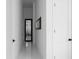 Modern hallway with white walls, sleek doors, and minimalist decor, providing a clean aesthetic at 4031 Oak Forest Cir, Marietta, GA 30062