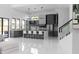 Modern kitchen with gray cabinets, a large island with seating, and stainless steel appliances at 4031 Oak Forest Cir, Marietta, GA 30062