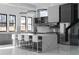 Contemporary kitchen with stainless steel appliances, waterfall island, and gray cabinets at 4031 Oak Forest Cir, Marietta, GA 30062