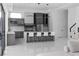 Modern kitchen with gray cabinets, a large island with seating and stainless steel appliances at 4031 Oak Forest Cir, Marietta, GA 30062